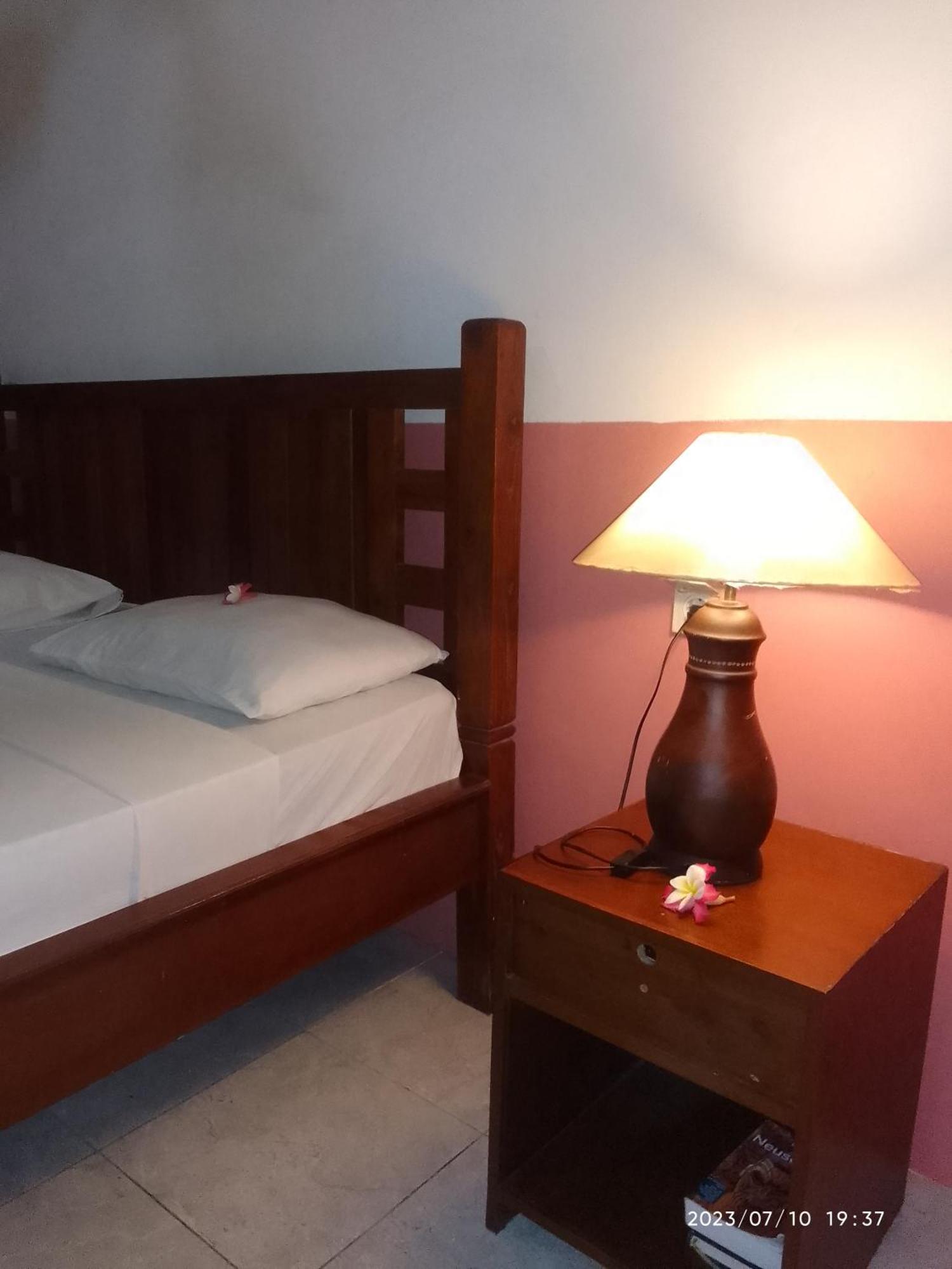 Kputra Homestay Amed Quarto foto