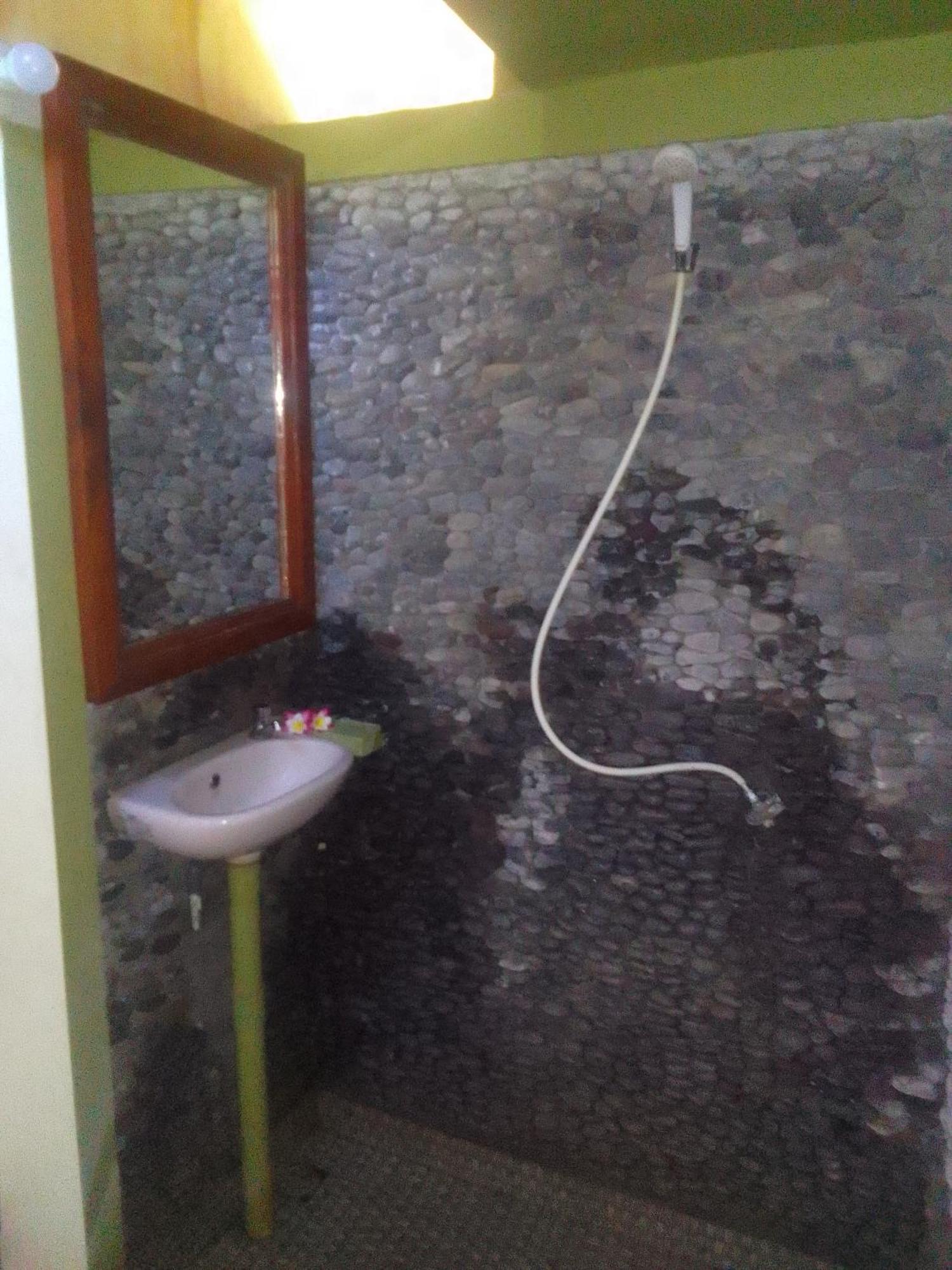Kputra Homestay Amed Quarto foto